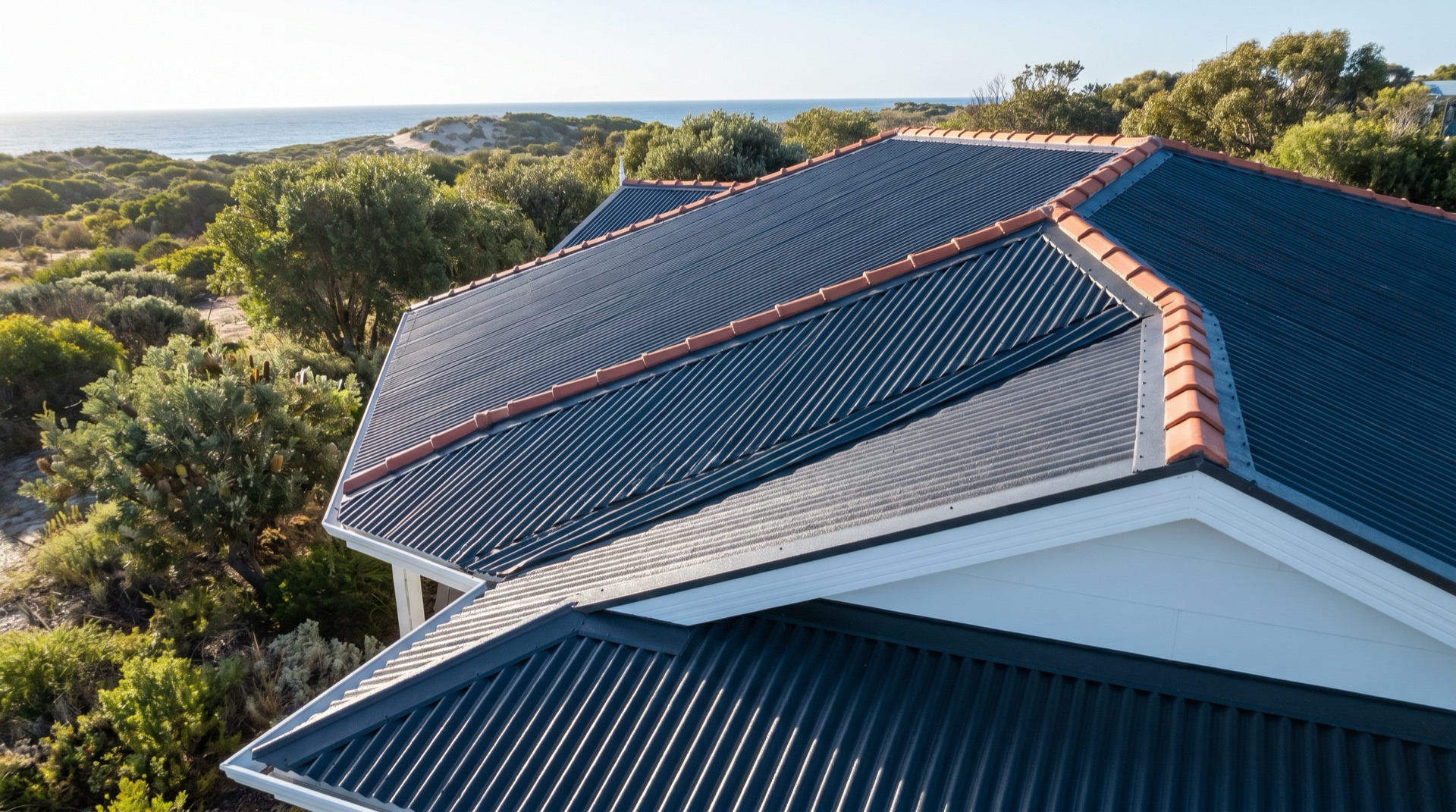 Roof restoration on a coastal home in Eden with charcoal Colorbond